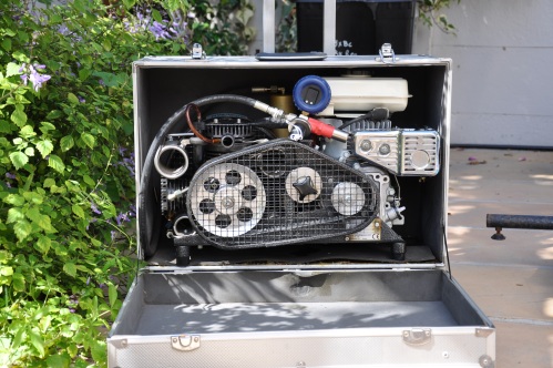 The compressor inside its carry case